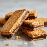 A stack of Buckeye Graham Crackers featuring peanut butter and chocolate filling between graham crackers.