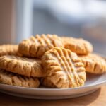 A plate of freshly baked Homemade Copycat Nutter Butters cookies, close-up.
